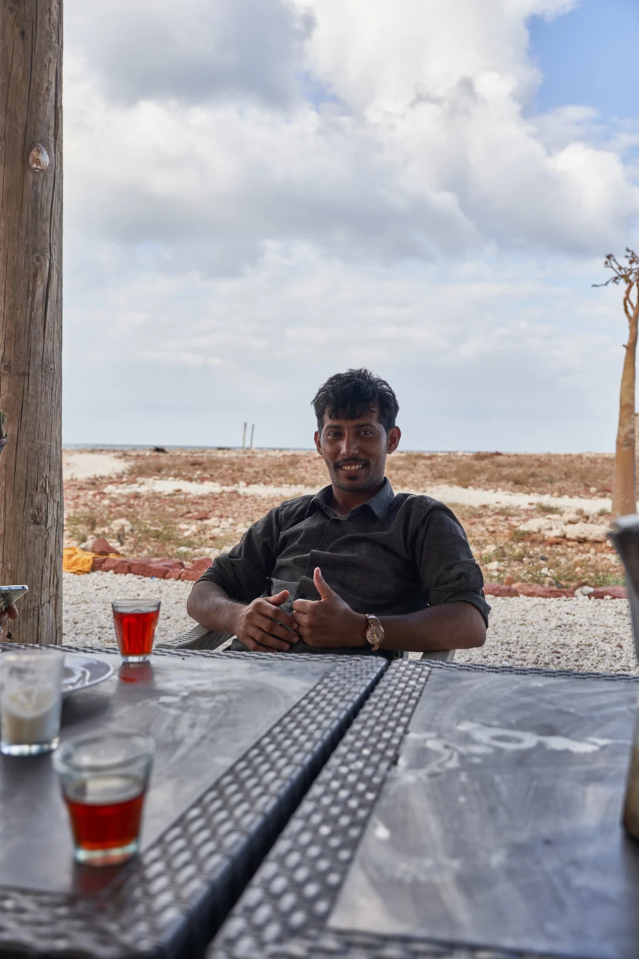 A relaxed moment with tea beside the coast in Socotra