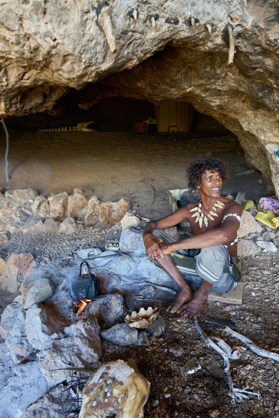 A local encounter beside a coastal cave shelter