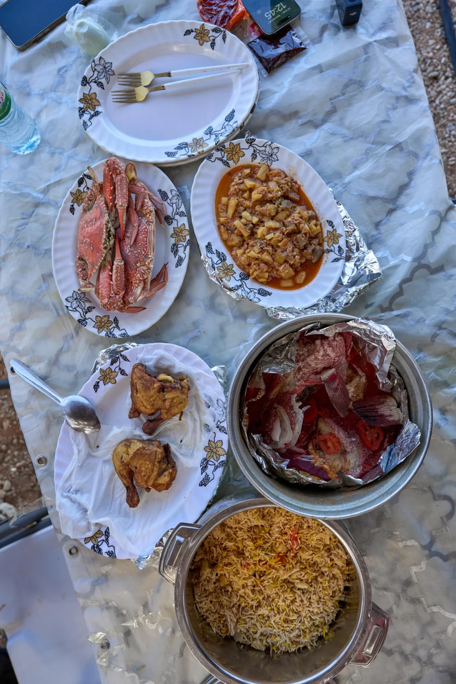 Fresh fish and dishes prepared for a shared meal