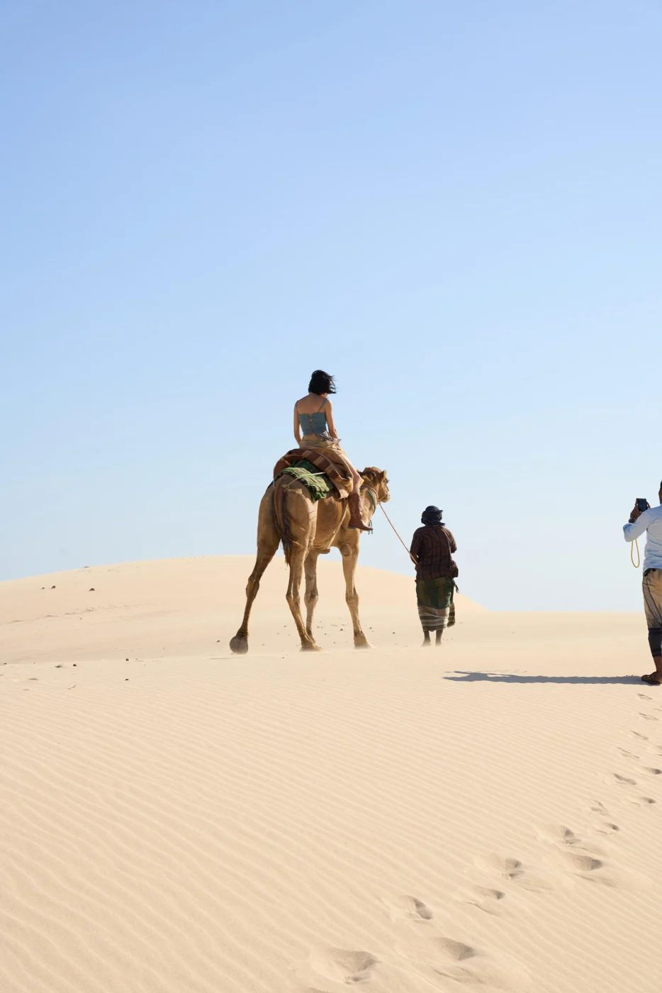A camel ride across the white sand dunes